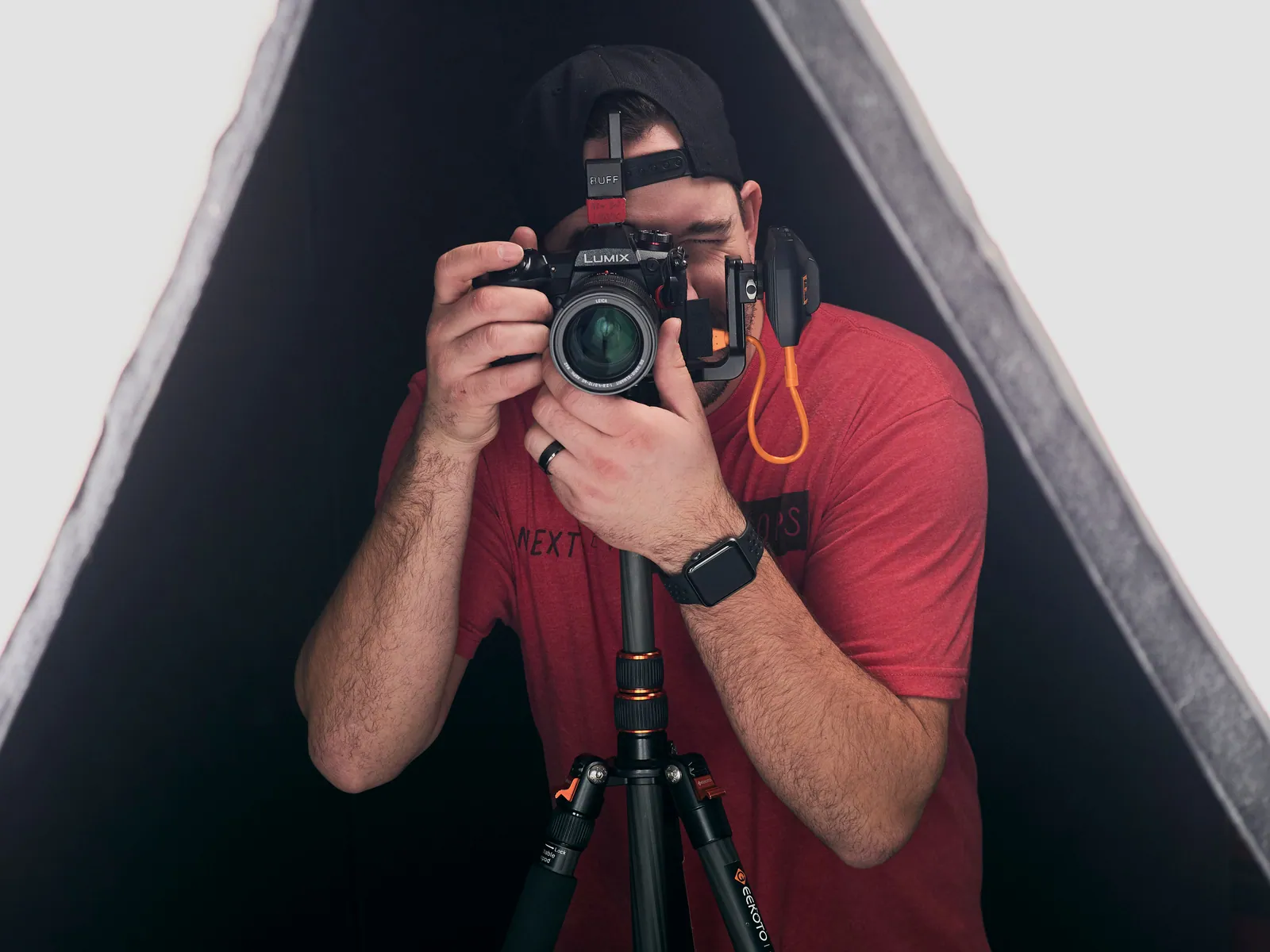 photographer is using the air direct by tether tools to wirelessly transfer images to a computer