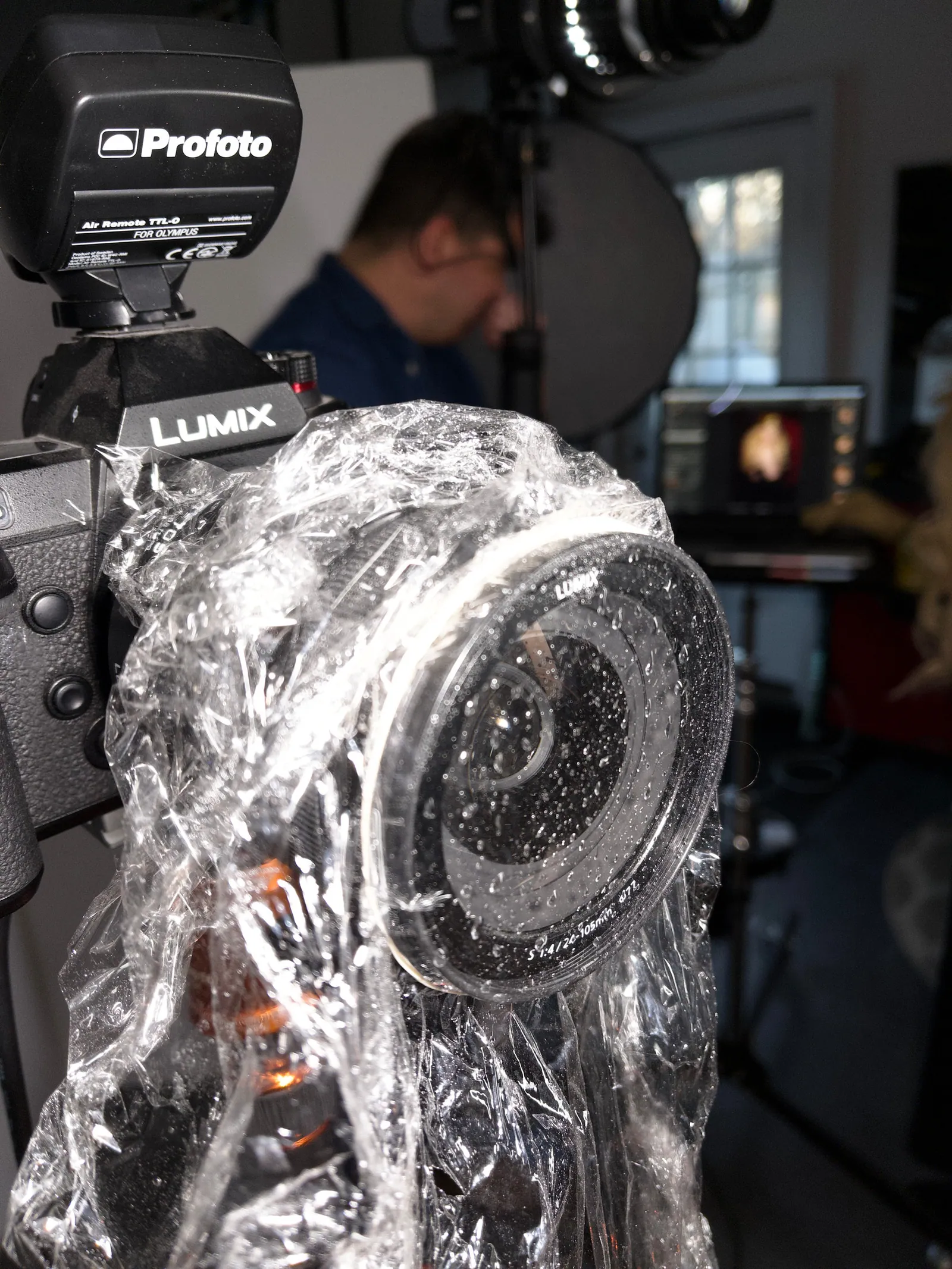 Plastic wrap on lens with glycerin and water spray